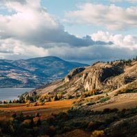 a view of a hill, in fall in
        the okanagan